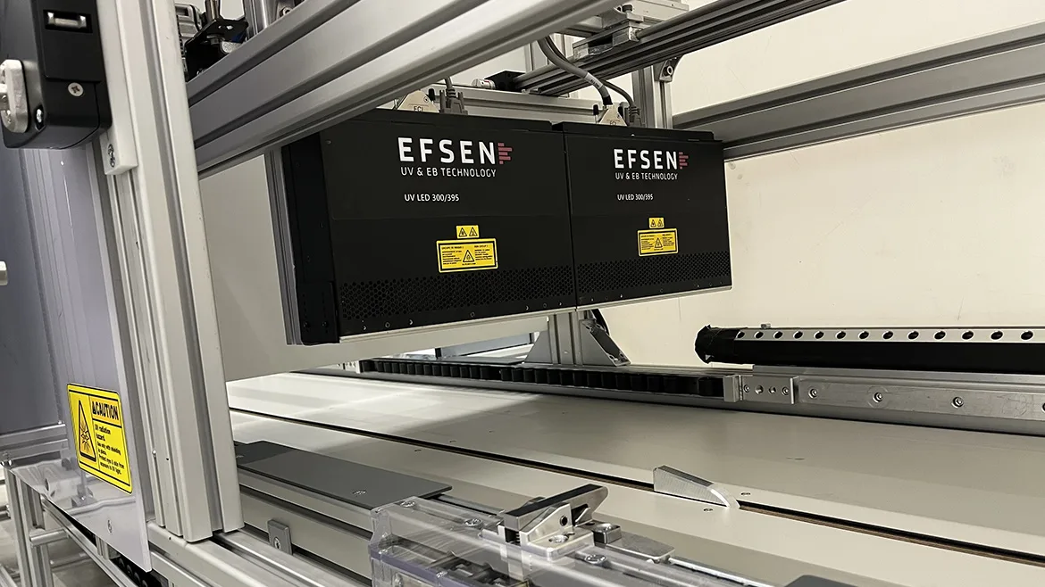 Industrial UV LED curing system mounted on an automated production line.