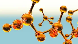 A vibrant 3D animation featuring a complex molecular structure made of a glossy, amber-colored glass material