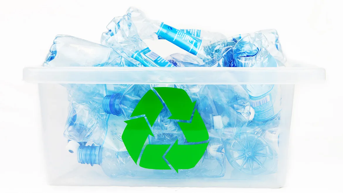 Water bottles with labels in a recycling box