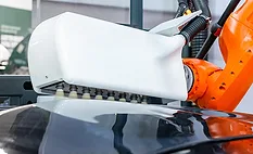 Automated Plasma Surface Treatment Industrial robot performing plasma surface treatment on an automotive component