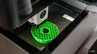 3d printer printing an object on the tray with pla filament, corn starch, non-waterproof filament