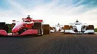 1-GI-1395665304-1170x658.jpg Front view of a fast-moving generic red race car leading group on a race track