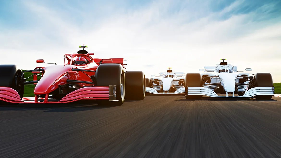 1-GI-1395665304-1170x658.jpg Front view of a fast-moving generic red race car leading group on a race track