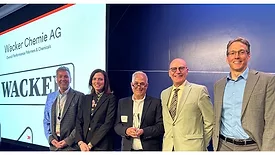 Picture of five people receiving award.