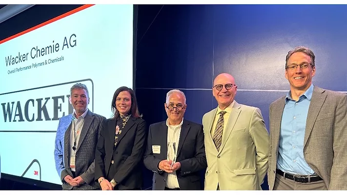 Picture of five people receiving award.