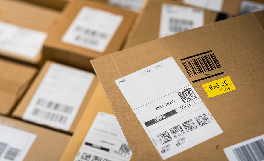 Photo of cardboard packages with shipping labels