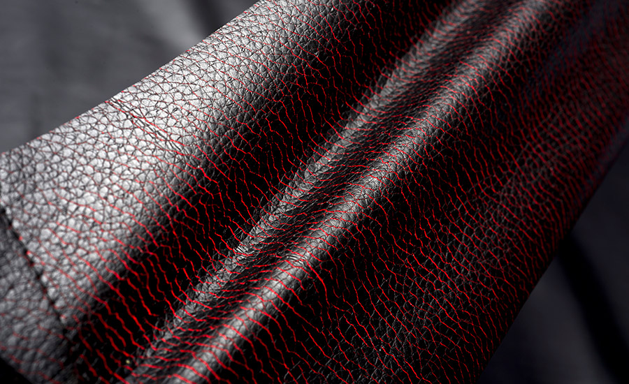 Image of a black textile with red thread