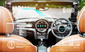 Image of a car dashboard and windshield with holographic images