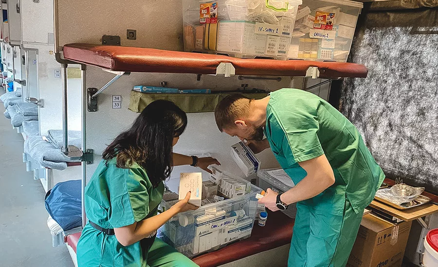Photo of medical personnel sorting medical supplies.