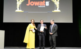Photo of a representative from Jowat receiving the best managed company award