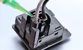 Photo of Master Bond epoxy encapsulant being applied to an electrical connection
