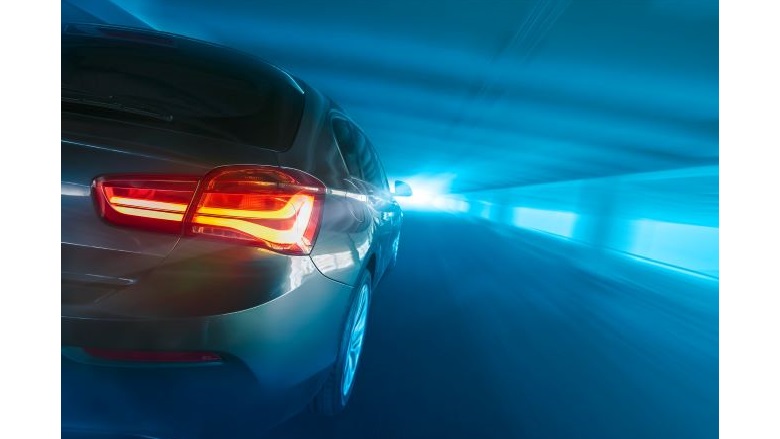 cars taillights as it drives down a tunnel