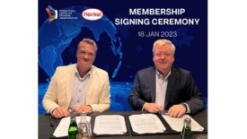 image of two men signing the agreement between henkel nad incit