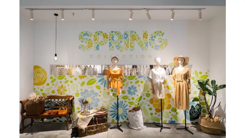 image of shopwindow with spring time dresses on display