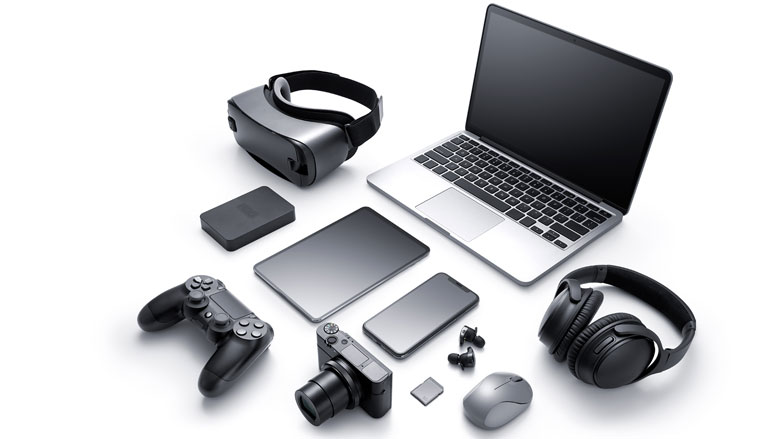 Image of computer, headphones, camera and other electronics