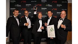 Representatives of ATP celebrate winning an award