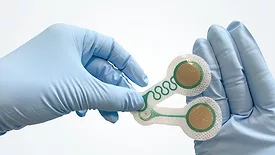 Gloved-hands-holding-electrode