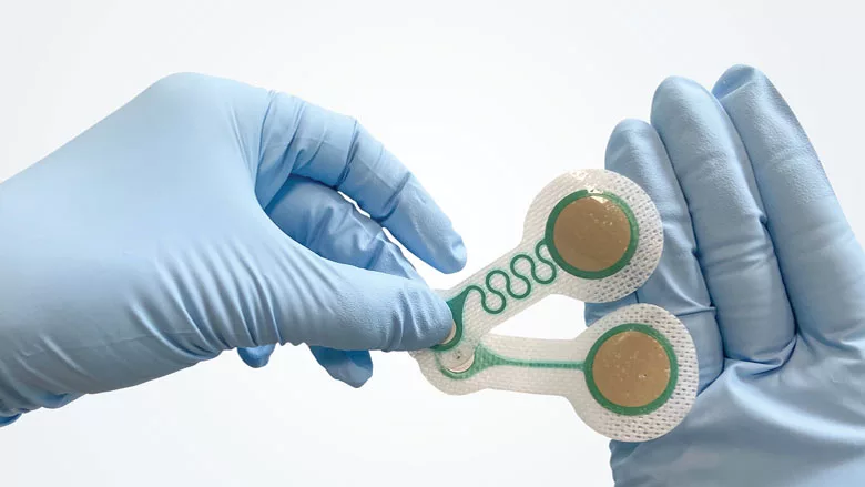 Gloved-hands-holding-electrode