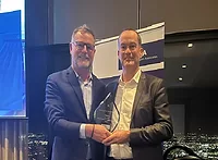 Photo of Sean Duffy receiving AWA Release Liner Industry Leadership Award