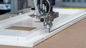 Image of adhesive being applied by robot