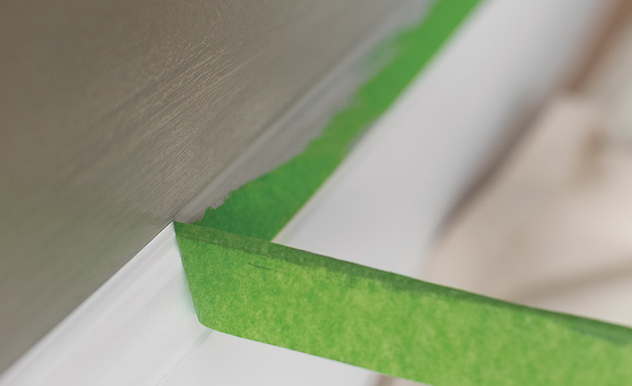 removing protective adhesive to crown molding to protect during painting
