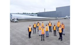 Image of The second ZEBRA blade seen at LM Wind Powers facility alongside consortium leaders.