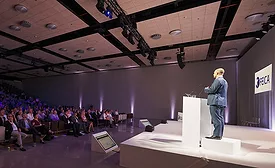 speaker giving presentation on stage at an event