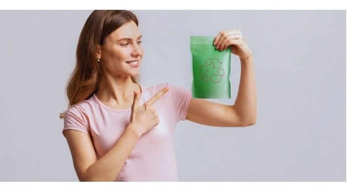 Woman holding a laminated adhesive package.