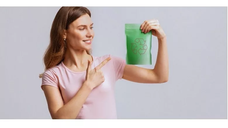 Woman holding a laminated adhesive package.