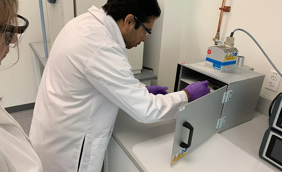 Devyesh Rana, applications engineer at the DELO facility in Sudbury, demonstrates some of the capabilities in the workshop. Image: Karen Parker. 