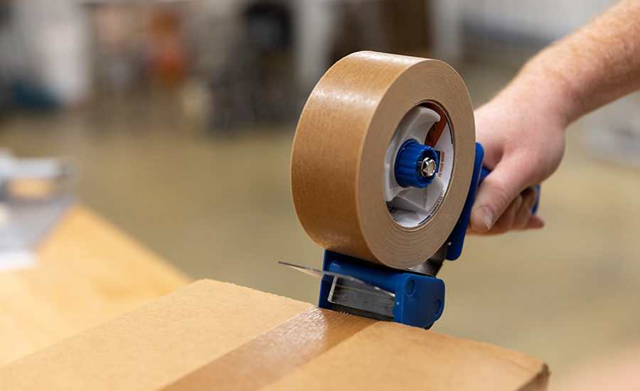 tape being applied to carboard package