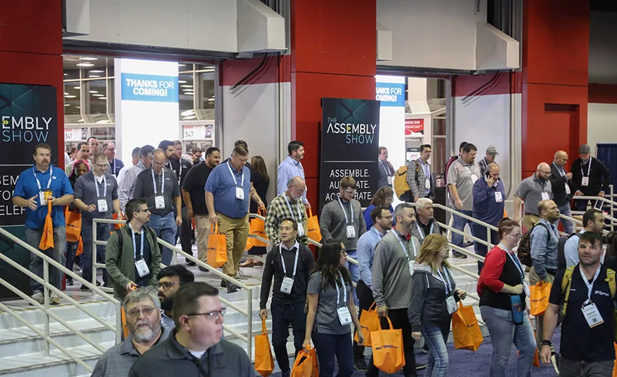 attendees entering the assembly show