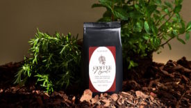 Picture of coffee packaging on top of mulch