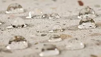Picture of water droplets on a sealed stone surface Picture of water droplets on a sealed stone surface