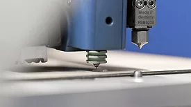 Application of hot-melt adhesive from nozzle