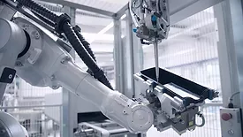 Picture of a Robafoam robot dispensing foam sealant