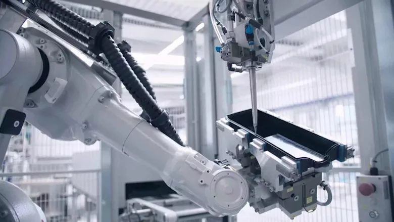 Picture of a Robafoam robot dispensing foam sealant