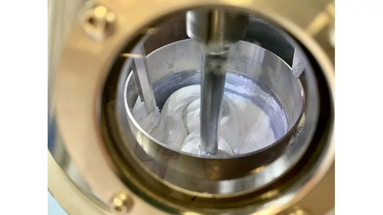 Picture of white sealant in mixing container