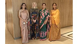 Four women standing at Lubrizol facility