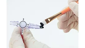 Picture of a silicone being applied to a medical device