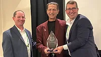 Daniel Murad receives the ASC Hall of Fame award Picture of a man receiving an award.