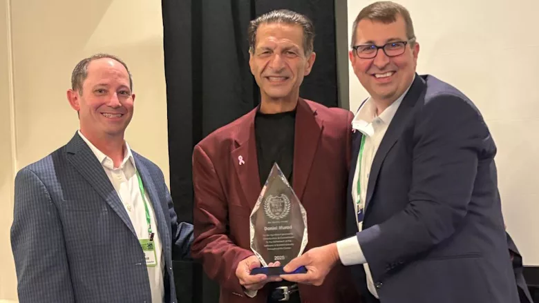 Picture of a man receiving an award.