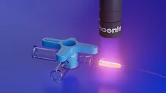 Picture of a medical device receiving UV curing