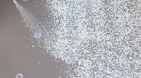 adhesives being sprayed on