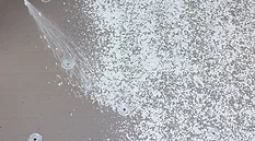 adhesives being sprayed on