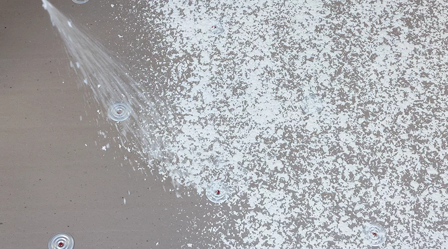 adhesives being sprayed on