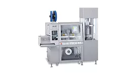 Picture of a machine that packages adhesives into tubes