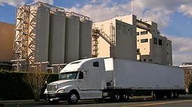 Big white truck outside a chemical facility. 