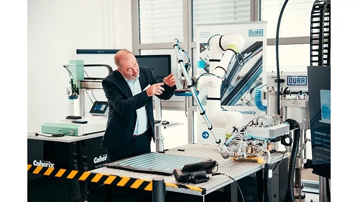 Picture of a man working on a machine.