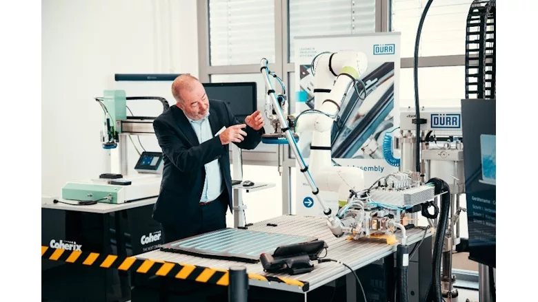 Picture of a man working on a machine.